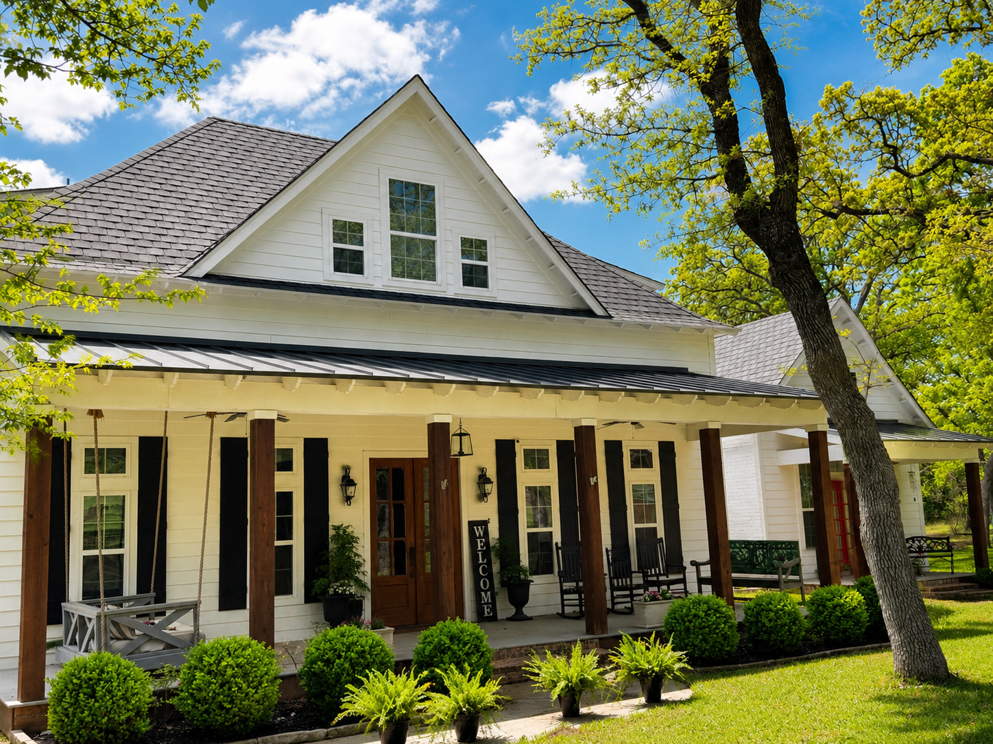 Covenant Oak Roofing completed project — white farmhouse with dark roof
